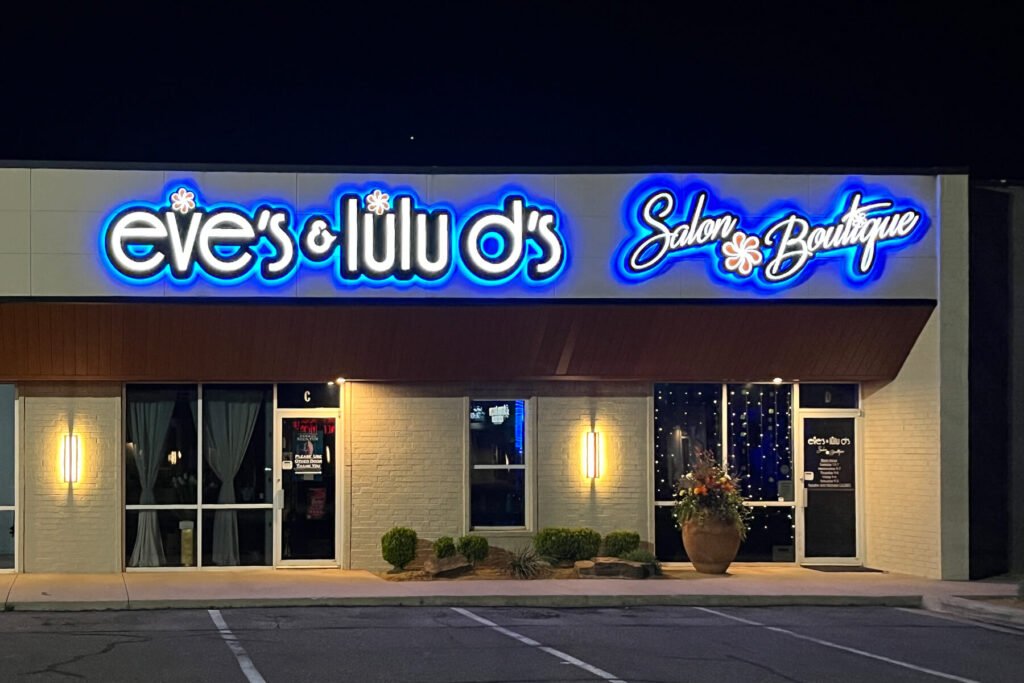 Exterior channel letters with front-lit, back-lit, and halo-lit illumination for Eve's & Lulu D's salon boutique.