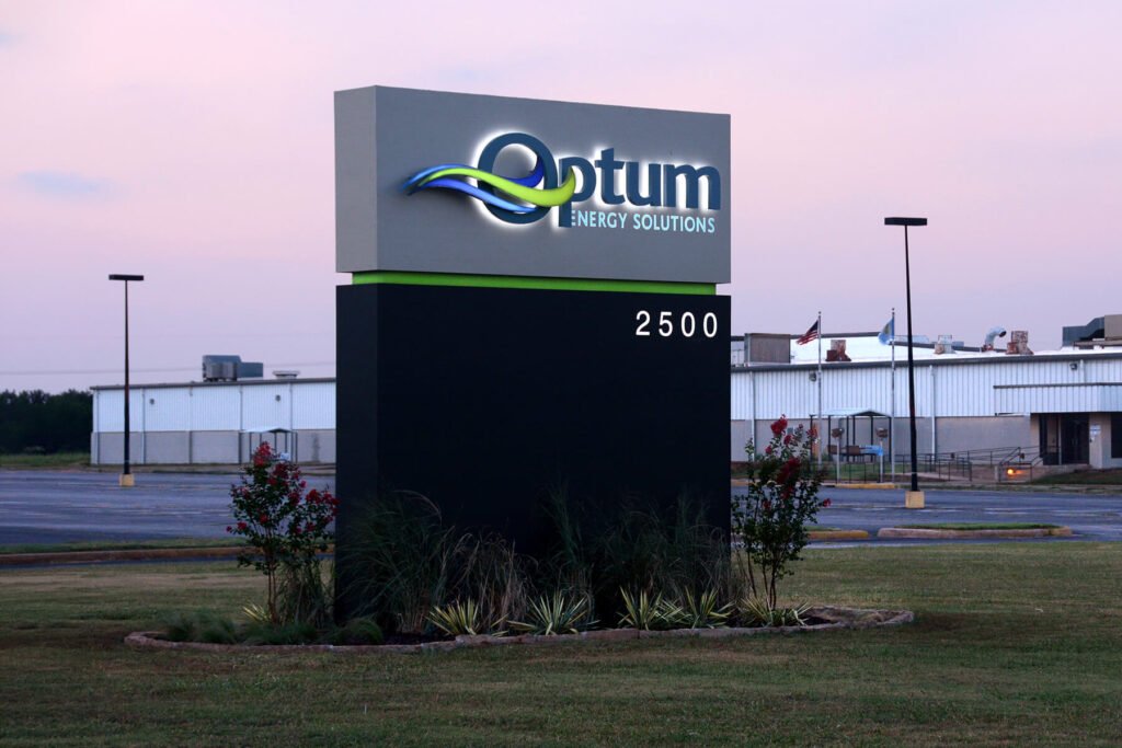 Exterior LED monument sign with front-lit, back-lit, and halo-lit elements for Optum Energy Solutions, an oil, gas, and specialty chemicals company.
