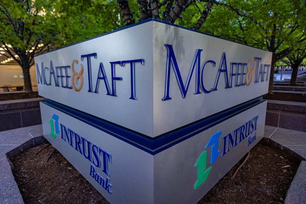 Exterior LED monument sign with push-through acrylic elements for McAfee & Taft and Intrust Bank tenants.