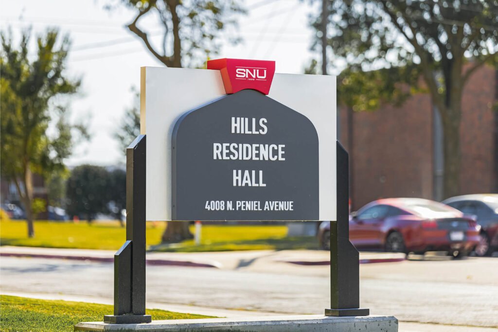 Exterior illuminated monument sign with push-through acrylic lettering for Southern Nazarene University.