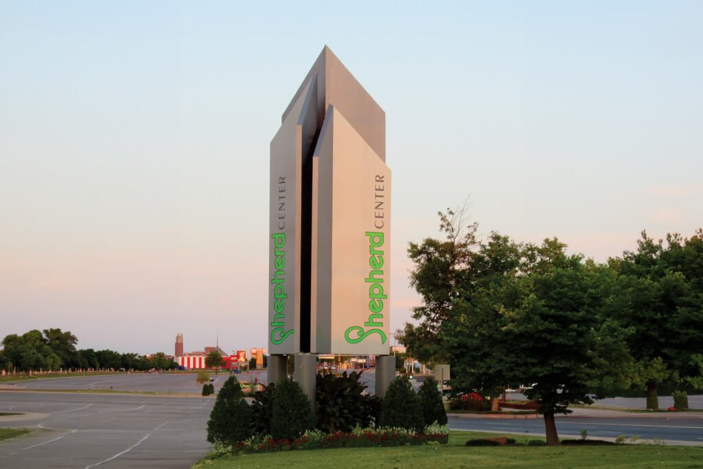 Exterior illuminated routed monument sign for Shepherd Center Mall shopping center.