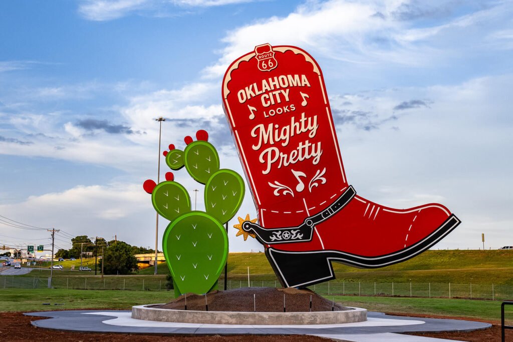 Exterior illuminated push-through channel sign featuring a boot and cactus sculpture for Kicks 66 in Oklahoma City, Oklahoma.