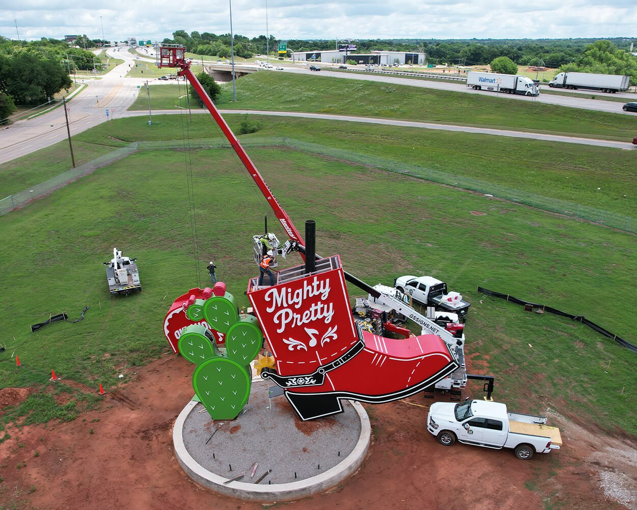 Installation progress with crane and trucks of the Kicks 66 sculpture at the bottom of Persimmon Hill located at the National Cowboy and Western Heritage Museum in Oklahoma, City, Oklahoma.