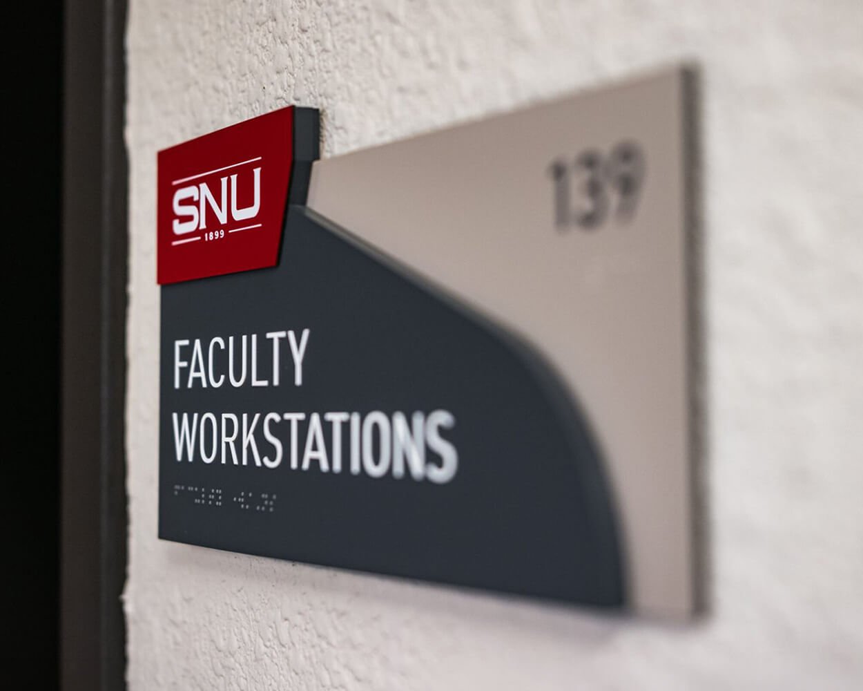 Interior indoor room number sign with 3-D printed raised braille for Southern Nazarene University.